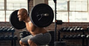 Man Lifting Weights at Gym ,..