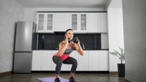 Young Woman Doing Squat Exercises at Home