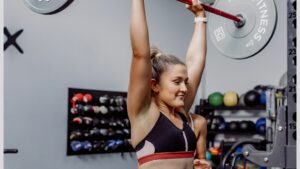 A Woman Lifting a Barbell