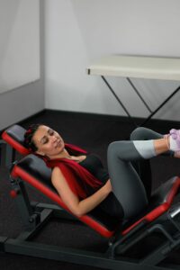 Woman on a Leg Press Machine in the Gym