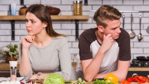 Free photo upset young couple in quarrel in kitchen