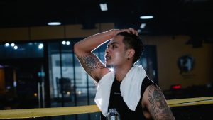 Latin American man with water in gym
