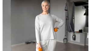elderly-woman-doing-dumbbells-exercises-gym.j