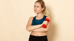 front-view-young-female-sport-outfit-holding-red-dumbbells-white-wall-health-sport-body-beauty-workout.jpg
