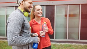 happy-couple-drinking-water-after-exercise.