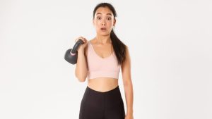 sport-wellbeing-active-lifestyle-concept-portrait-cute-brunette-asian-fitness-girl-sign-up-bodybuilding-classes-gym-surprised-with-weight-kettlebell-standing-white-background.jpg