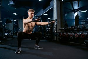 sportsman-doing-squats-gym.jpg