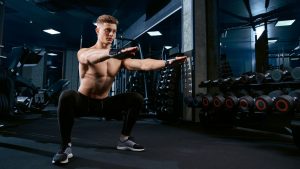 sportsman-doing-squats-gym.jpg