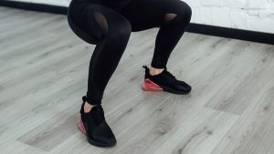 woman squatting with shoes