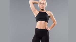 young-blonde-fit-sporty-girl-woman-black-sportswear-demostrate-her-strong-muscular-body-stretching.jpg