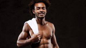 young-sportive-african-man-posing-black-wal