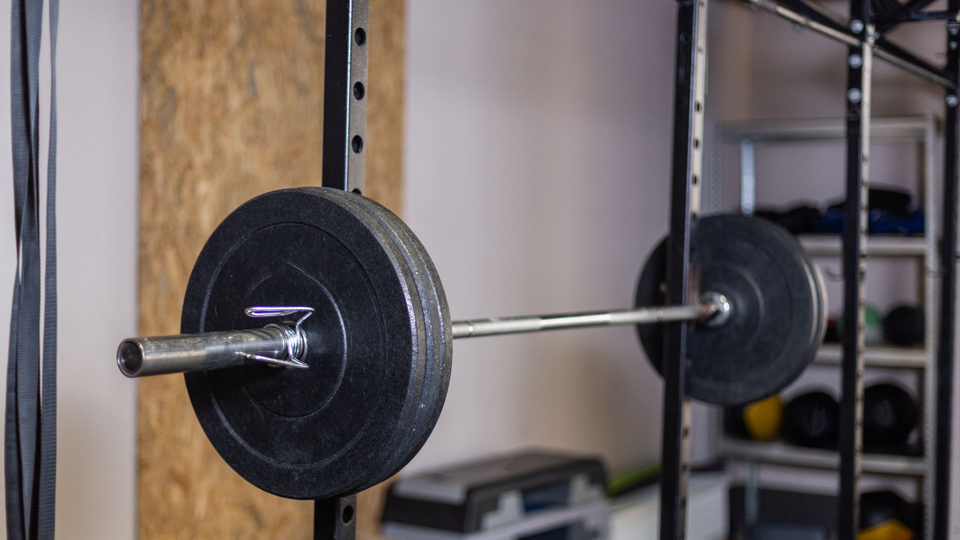 Heavy Barbell on a Squat Rack in a Modern Gym